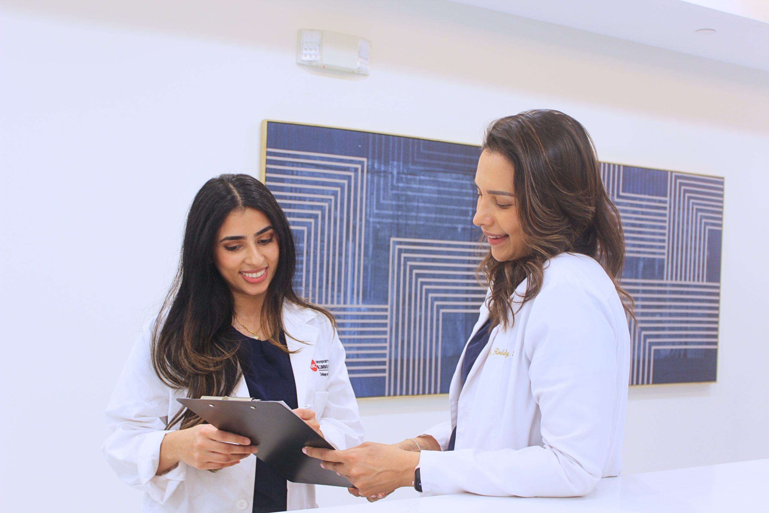 Smiles-on-Enterprise-Oak-Brook-IL-Dr-Jessica-Reddy-Dr-Yosra-Anjum-discussing